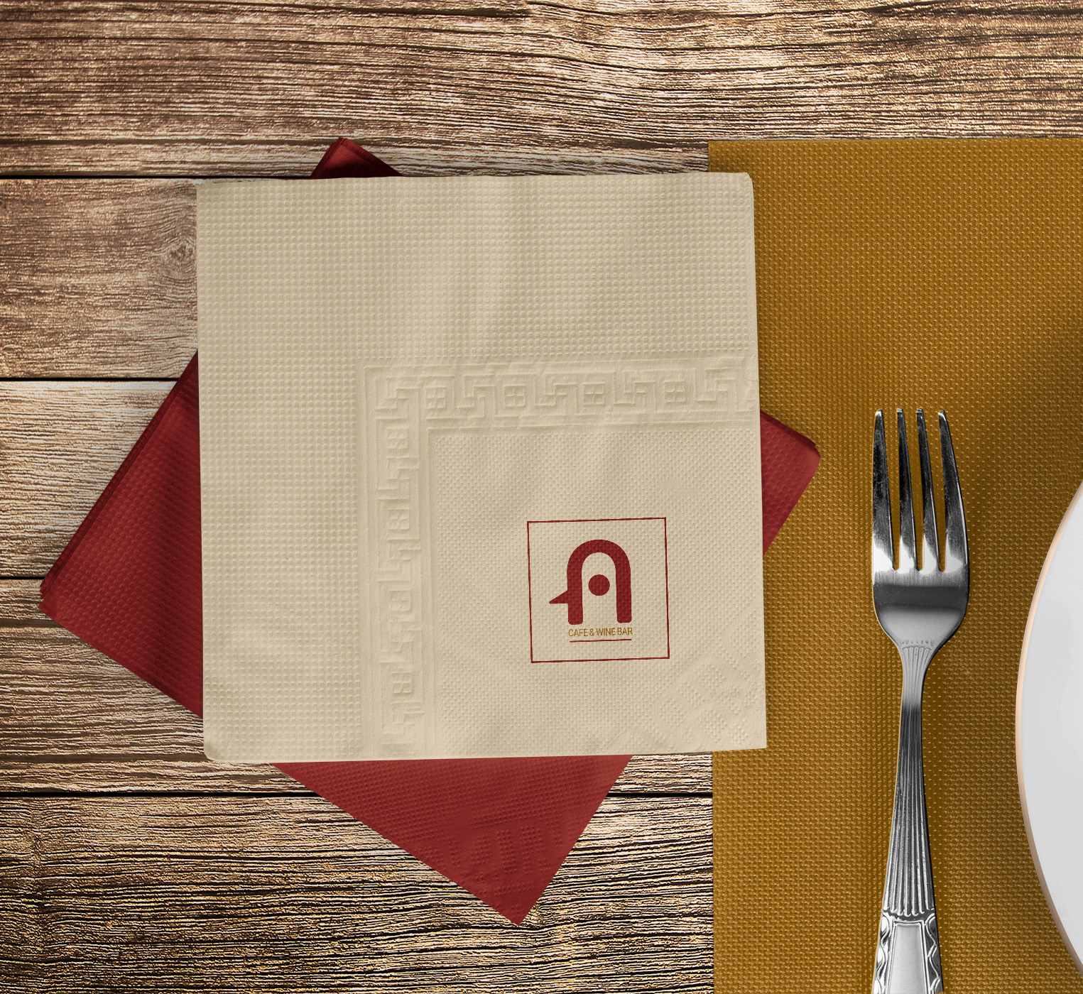 Brand Identity - Napkin with logo mockup on restaurant table.
